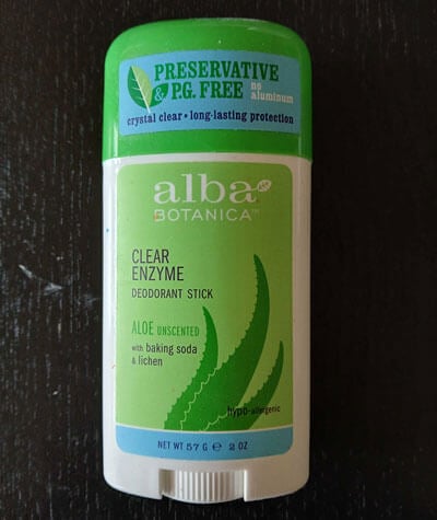 White Alba logo on light green deodorant label.
